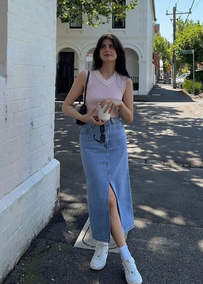 denim skirt at raflo woman wearing a denim skirt stands confidently, showcasing her casual yet stylish outfit