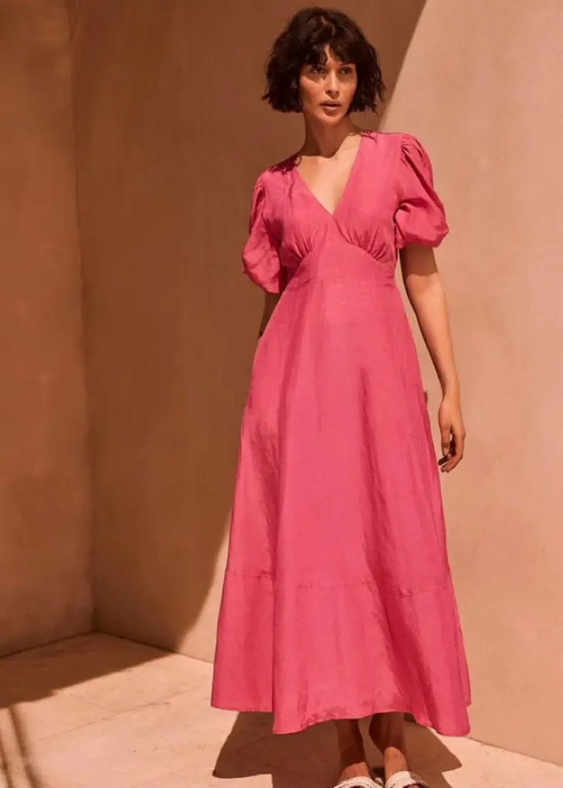 A stylish pink midi dress ideal for summer wear, showcasing a comfortable and breezy design maxi dresses for women in kerala